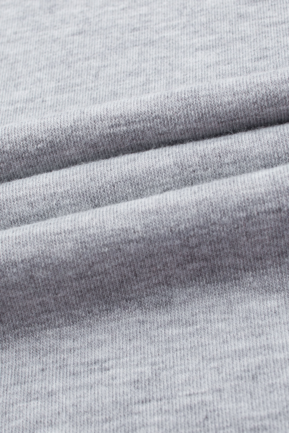 Sivi jednobojni kombinezon sa širokim nogavicama na naramenice velike veličine