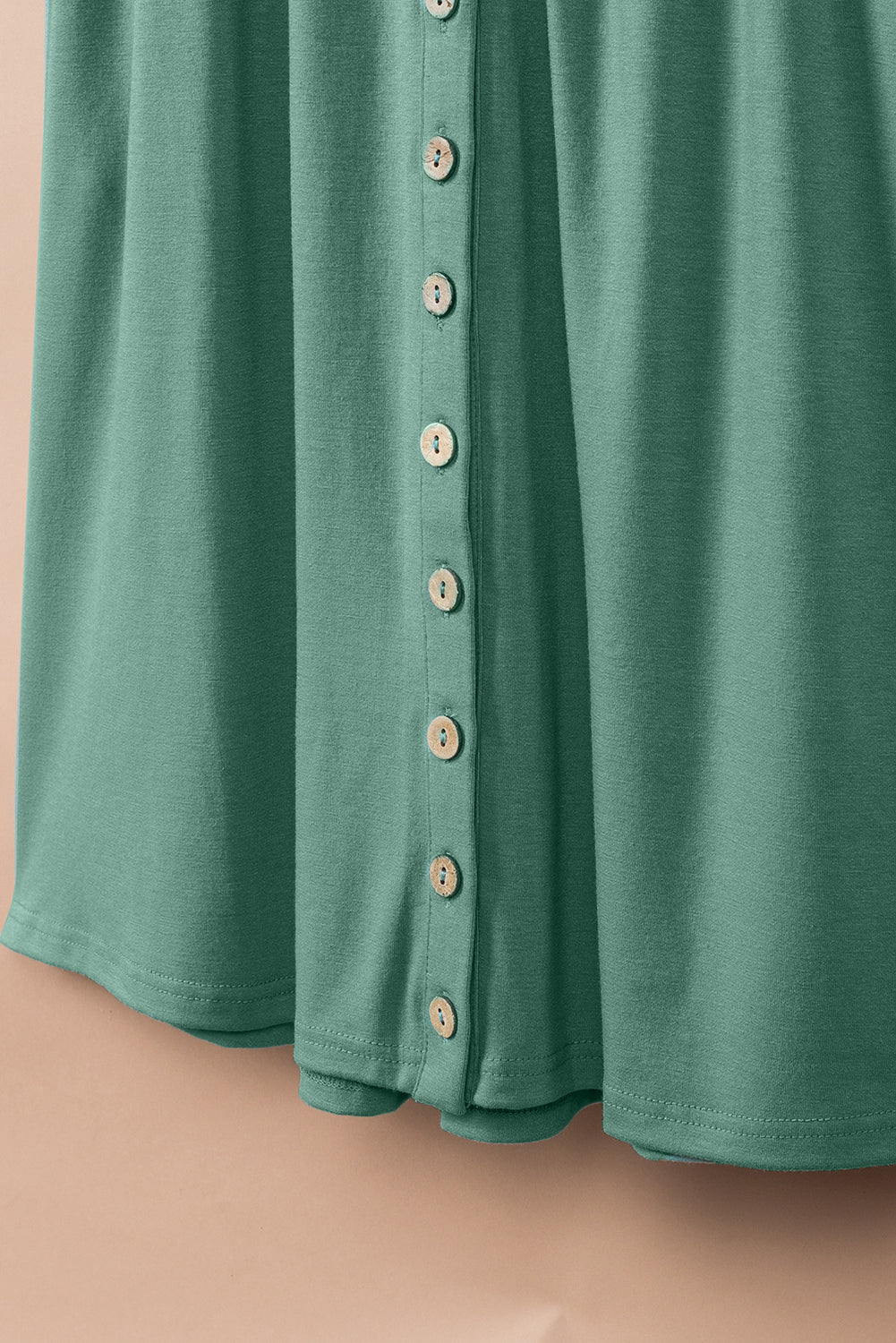 Ärmelloses Minikleid mit hoher Taille und grünen Knöpfen