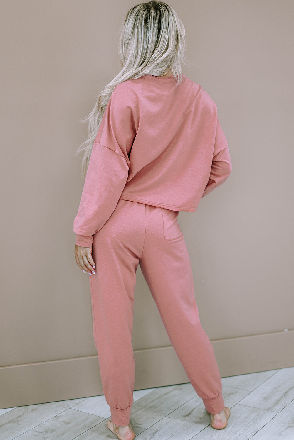 Completo pullover e pantaloni sportivi squadrati rosa tinta unita