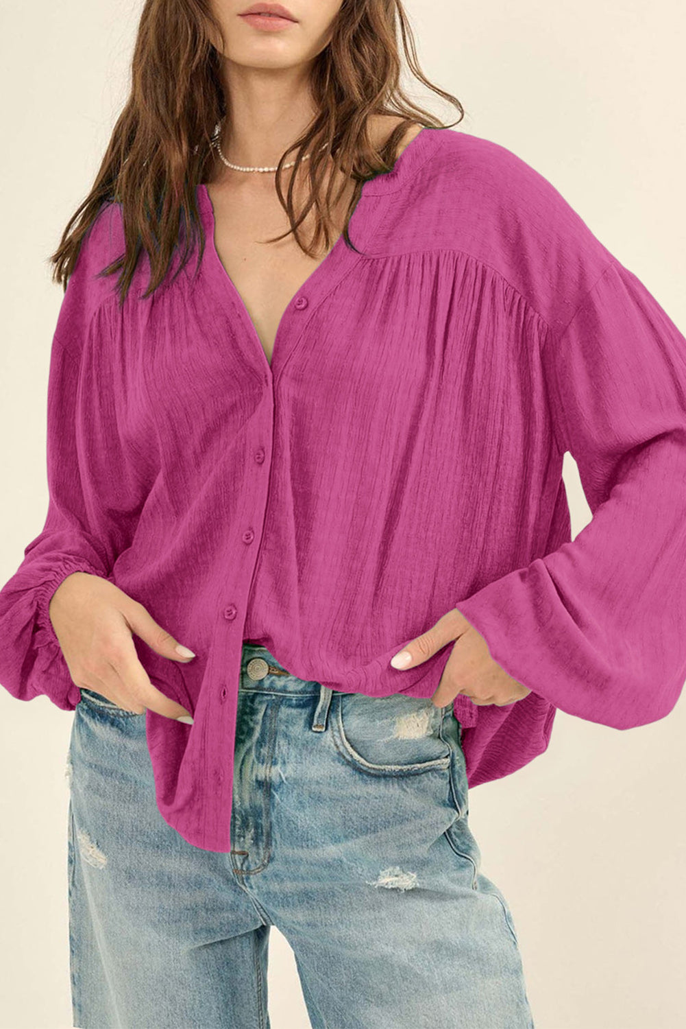 Chemise boutonnée à manches bouffantes en jacquard de couleur unie rose