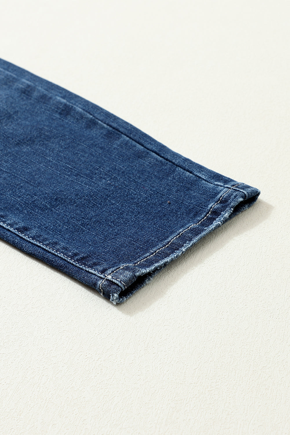 Jean skinny taille haute bleu délavé vintage à deux boutons