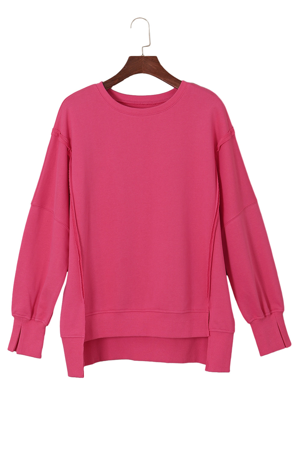 Sweat-shirt rose à coutures apparentes, épaules tombantes, fente, ourlet haut et bas