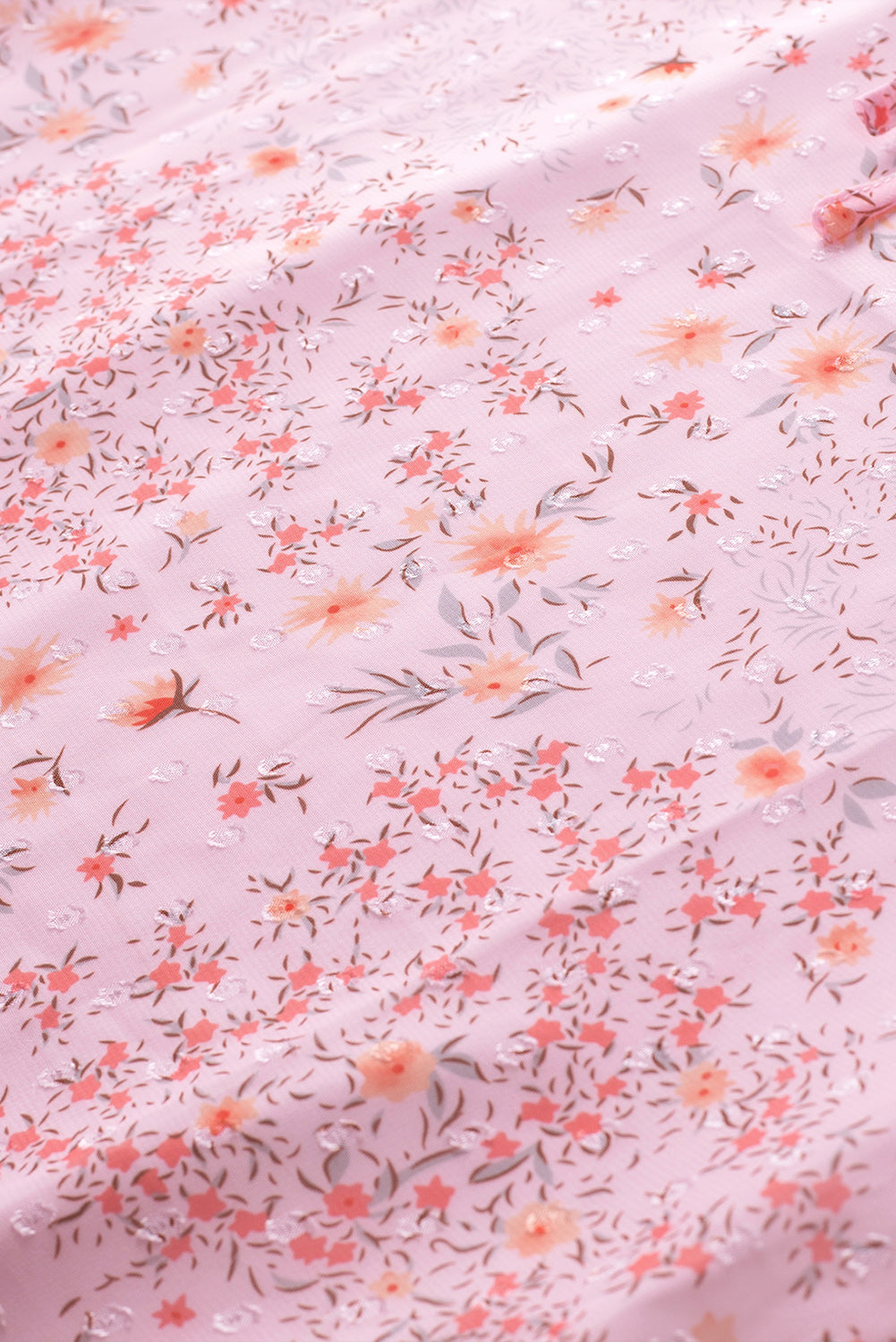 Haut sans manches rose à imprimé floral avec cordon de serrage et bordure à volants