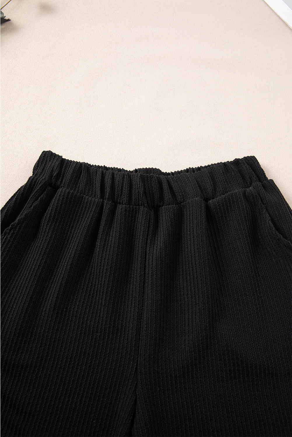 Set aus schwarzem schnurgebundenem ärmellosem Oberteil und Shorts mit Taschen
