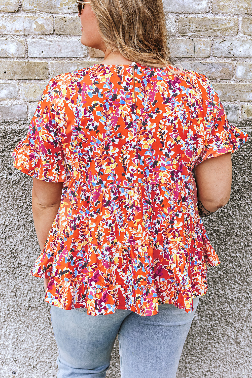 Orangefarbene, kurvige Babydoll-Bluse mit Blumenmuster und Rüschenärmeln