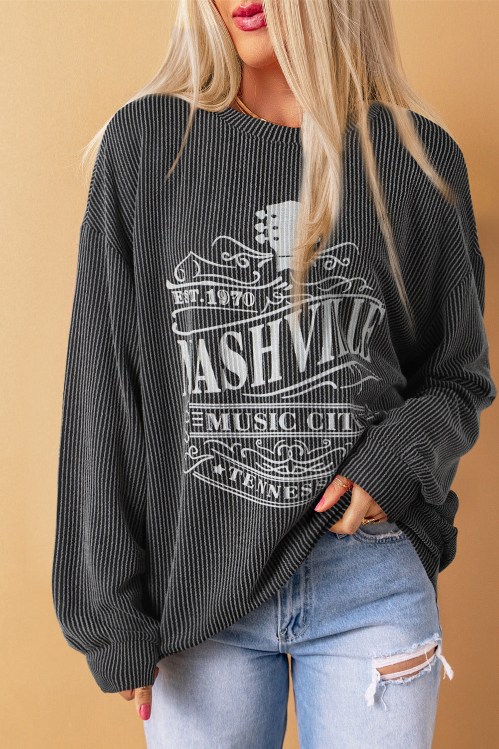 Aprikosenfarbenes NASHVILLE MUSIC CITY Cord-Sweatshirt mit Grafik
