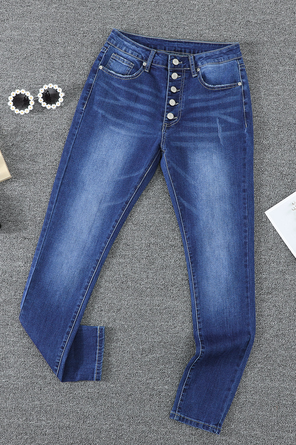 Jeans blu con bottoni skinny a vita alta