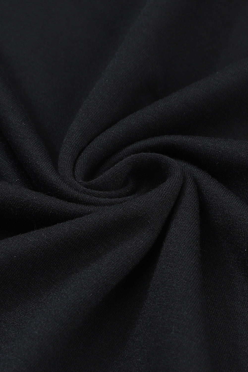 Schwarzes, asymmetrisch ausgeschnittenes, langärmliges Oberteil mit Knöpfen