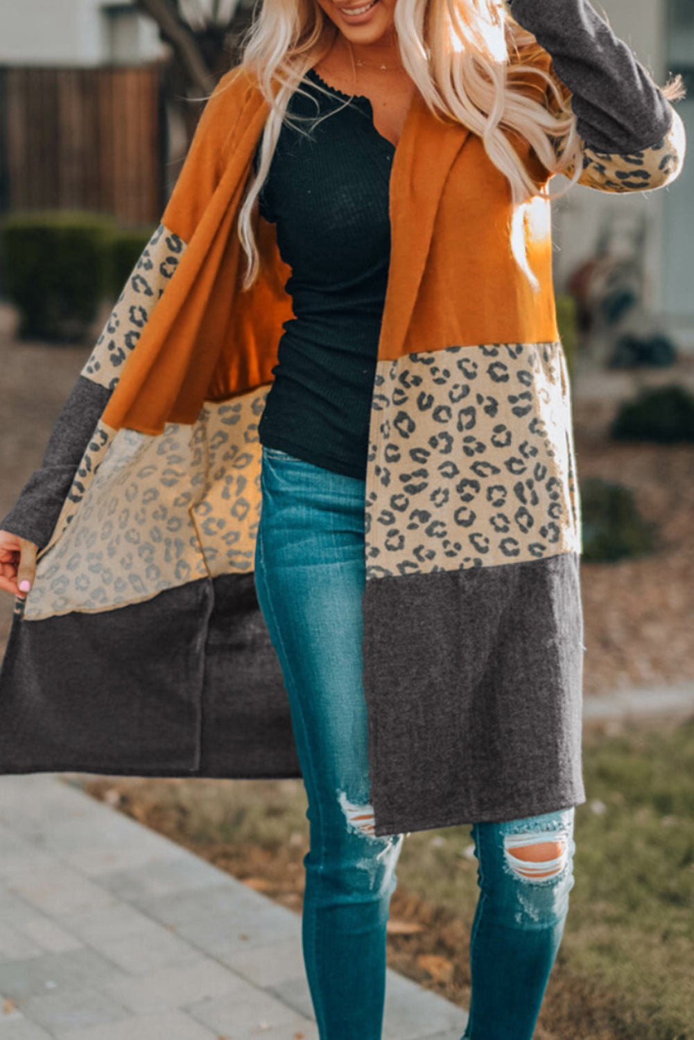 Cardigan in maglia patchwork con stampa leopardata color block arancione