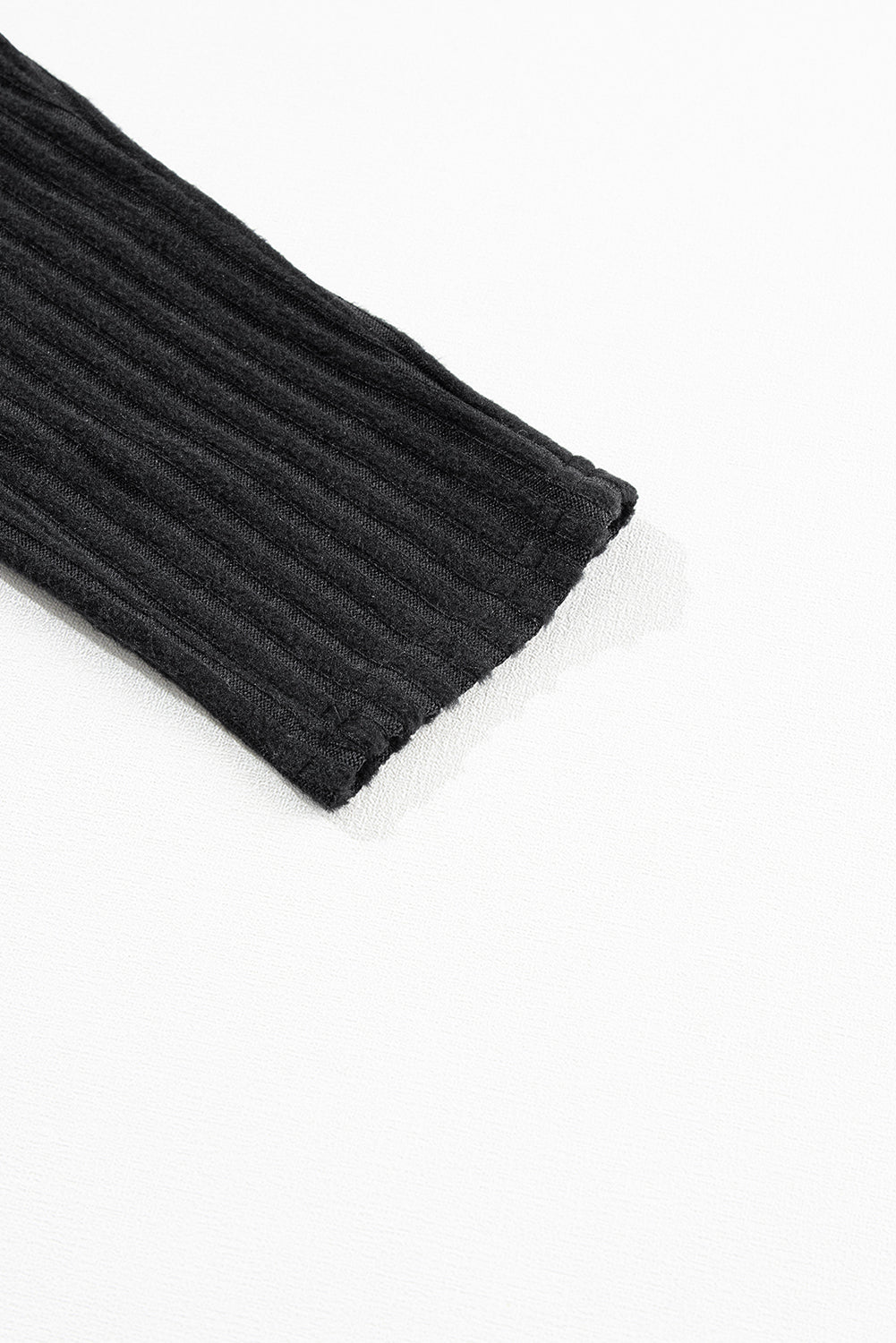 Crne rebraste teksturirane pletene tajice sa širokim pojasom