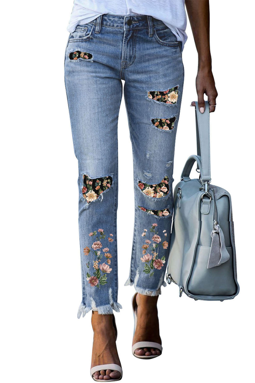 Jeans skinny strappati con toppa stampata celeste