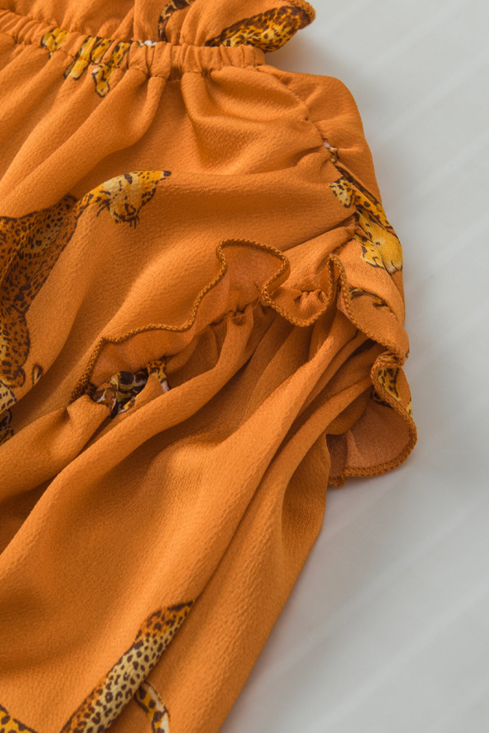 Narančasta bluza s naboranim rukavima s uzorkom geparda