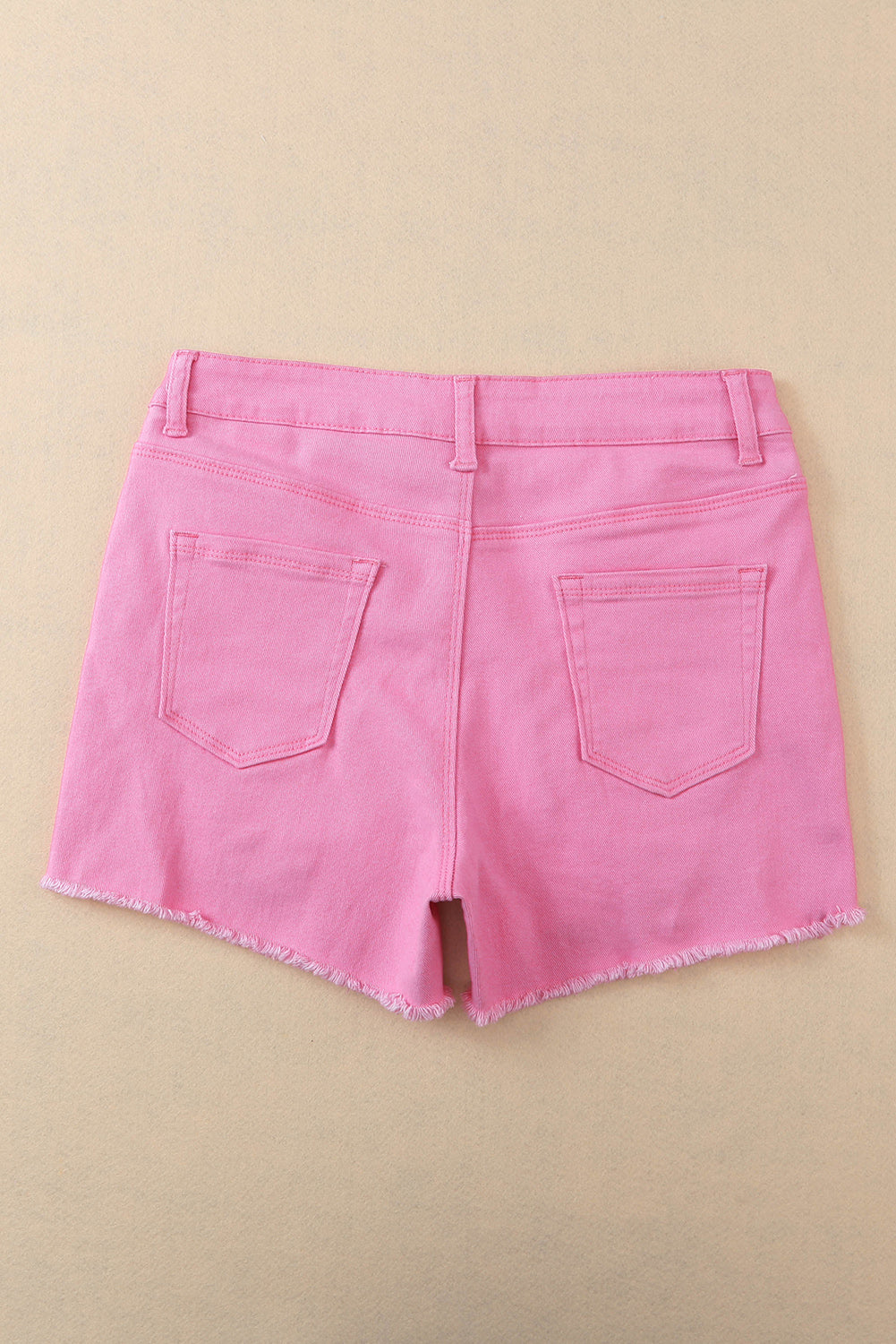 Pantaloncini in denim invecchiato tinta unita rosa