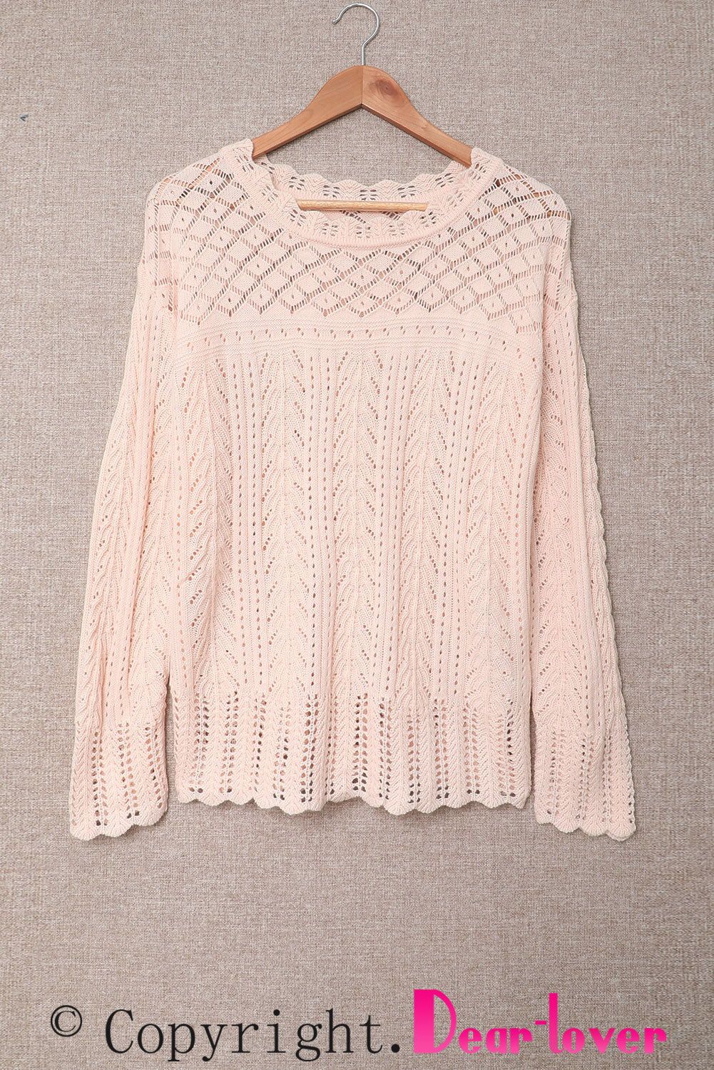 Ružičasti jednobojni pleteni pulover na spuštena ramena