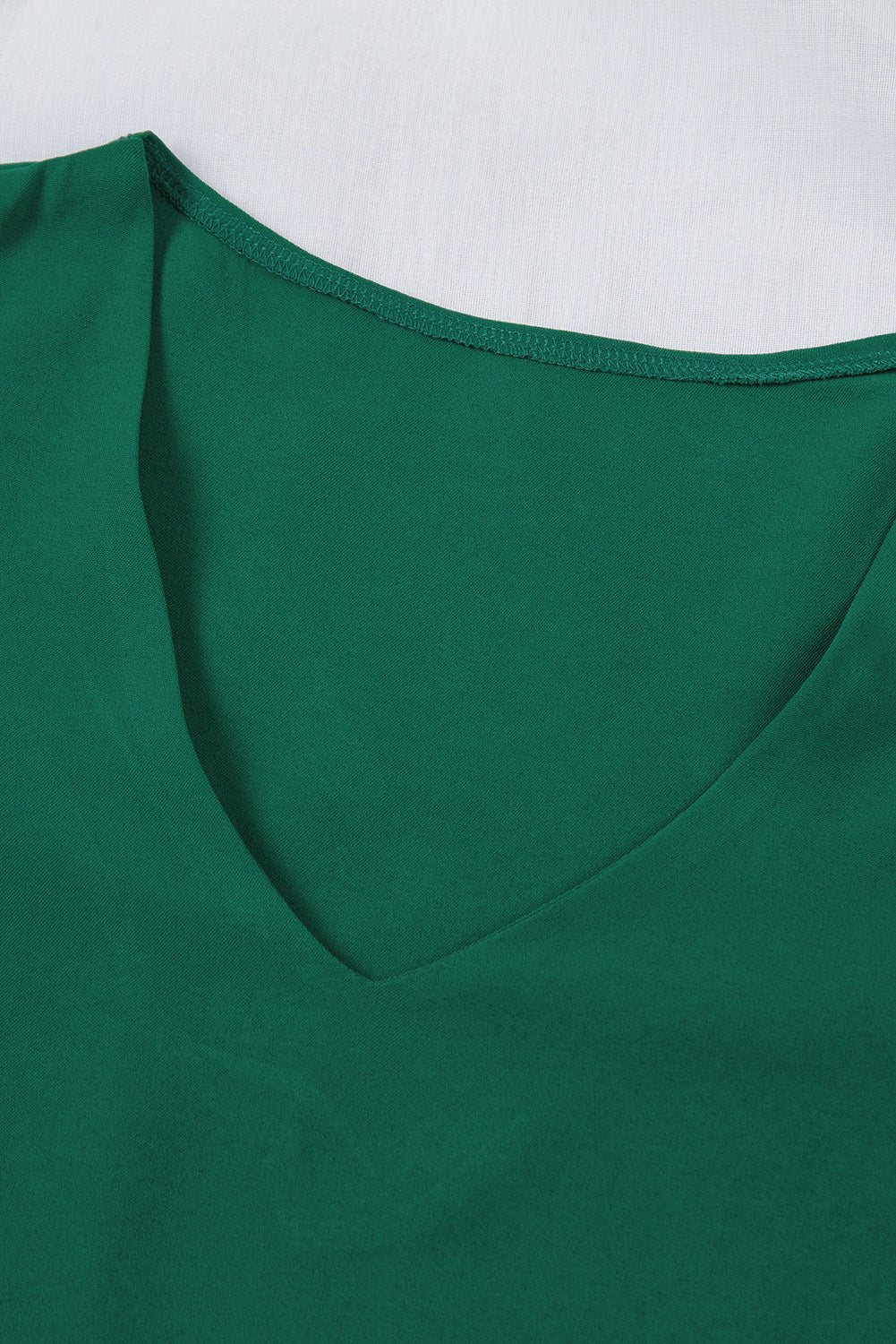 Zelena ohlapna bluza z širokimi rokavi in ​​v-izrezom