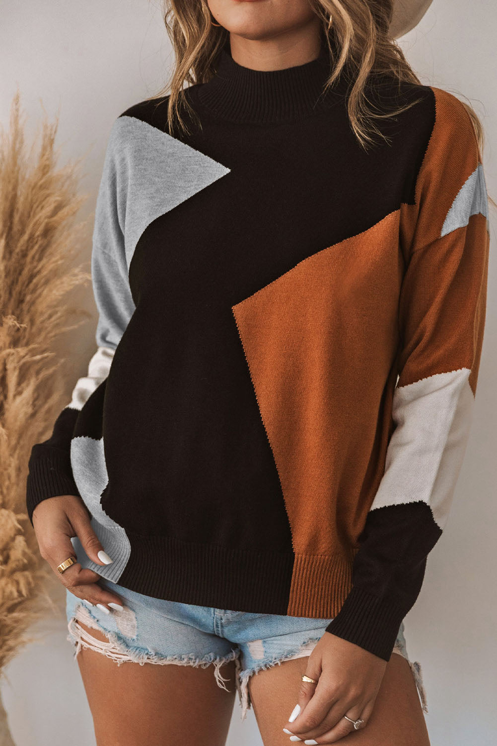 Pleten pulover z navideznim ovratnikom in spuščenimi rameni v oranžni barvi
