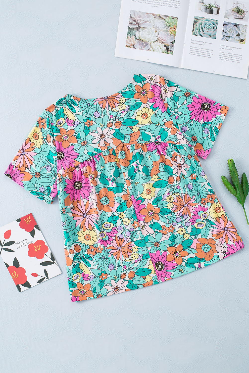 Mehrfarbige, kurzärmlige Babydoll-Bluse mit Blumendruck