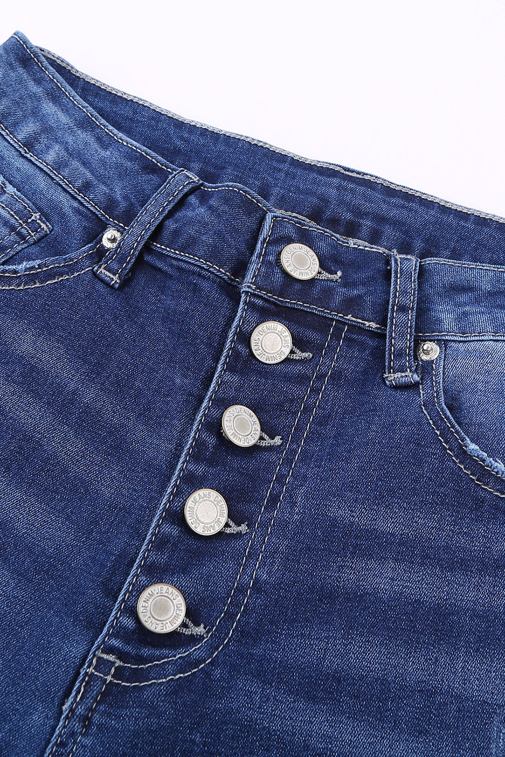 Blaue Skinny-Jeans mit Knopfleiste und hohem Bund