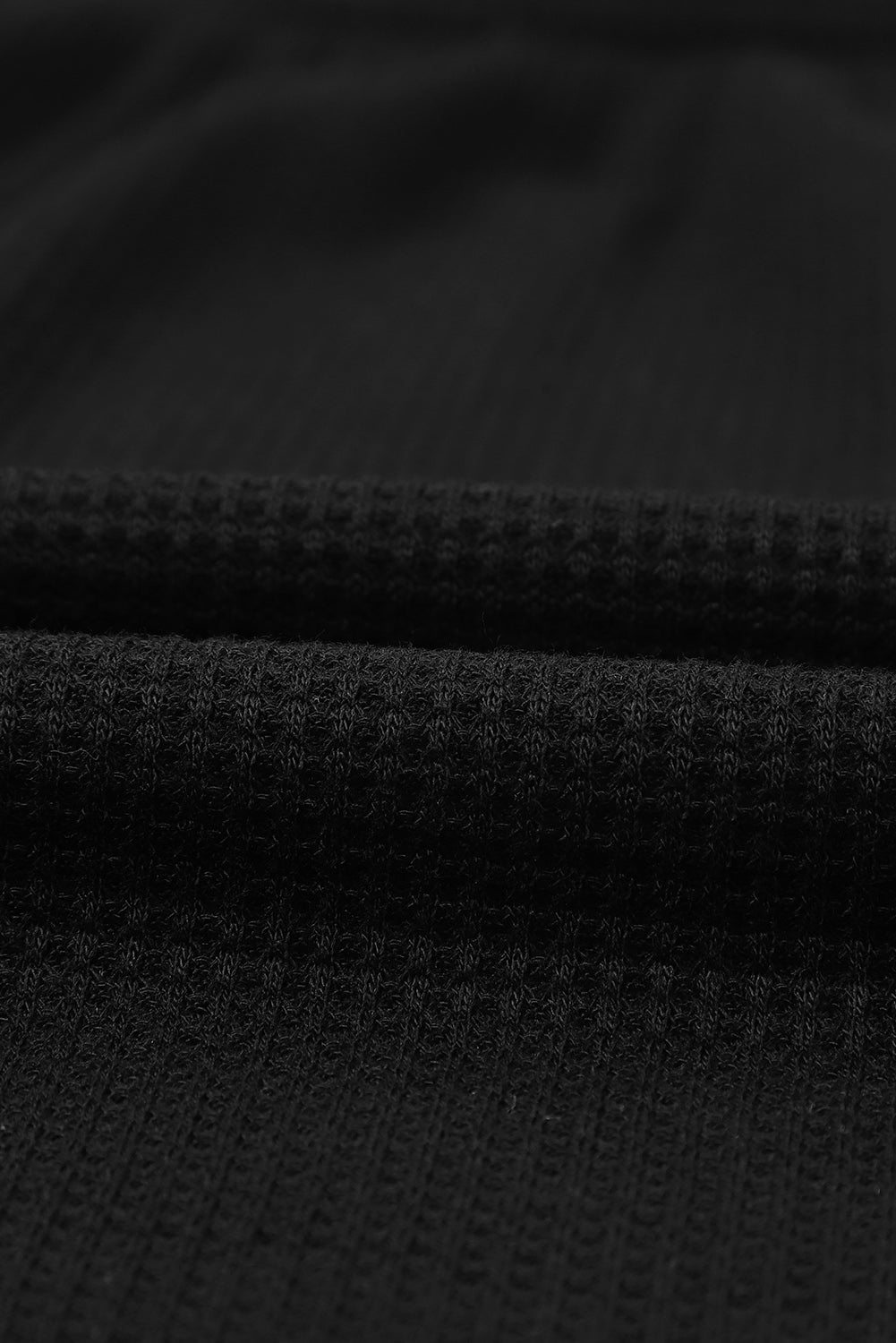 Schwarzes Oberteil aus Waffelstrick mit U-Ausschnitt und Puffärmeln