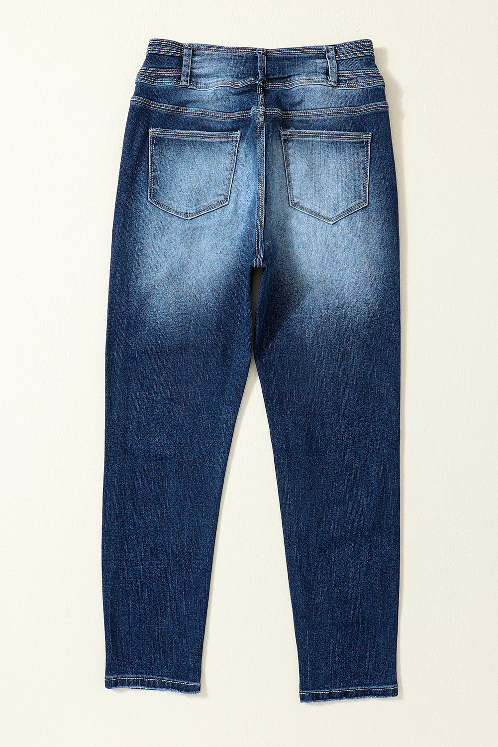 Jeans skinny a vita alta a due bottoni blu lavati vintage