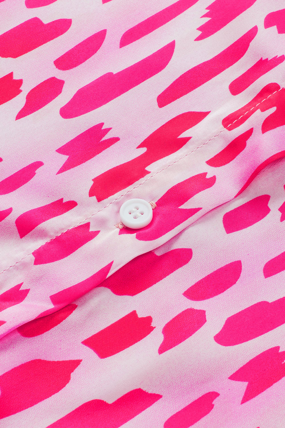 Camicia con bottoni sulla manica con linguetta arrotolata stampata rosa