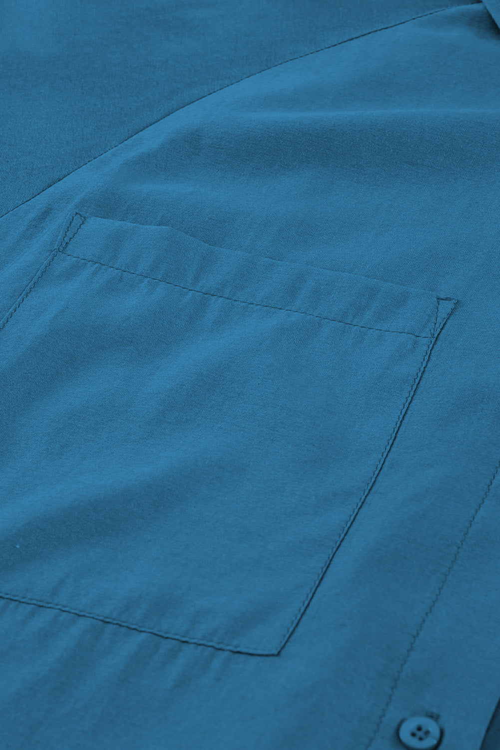 Chemise bleue à poches et manches bouffantes