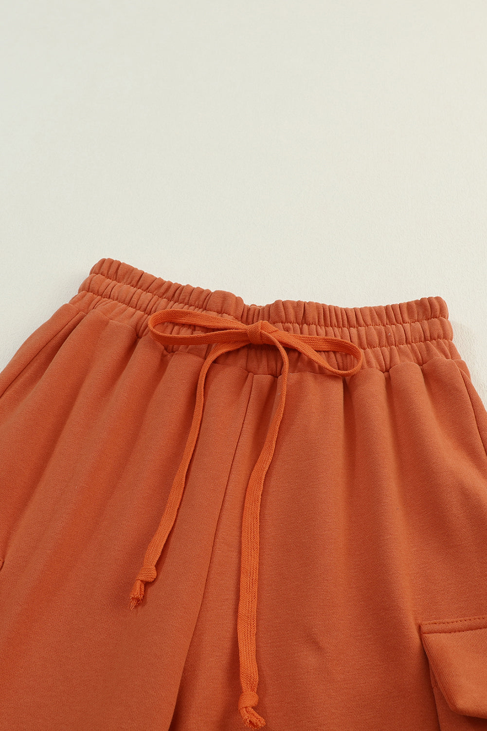 Pantaloni jogger con tasche cargo arancioni con coulisse