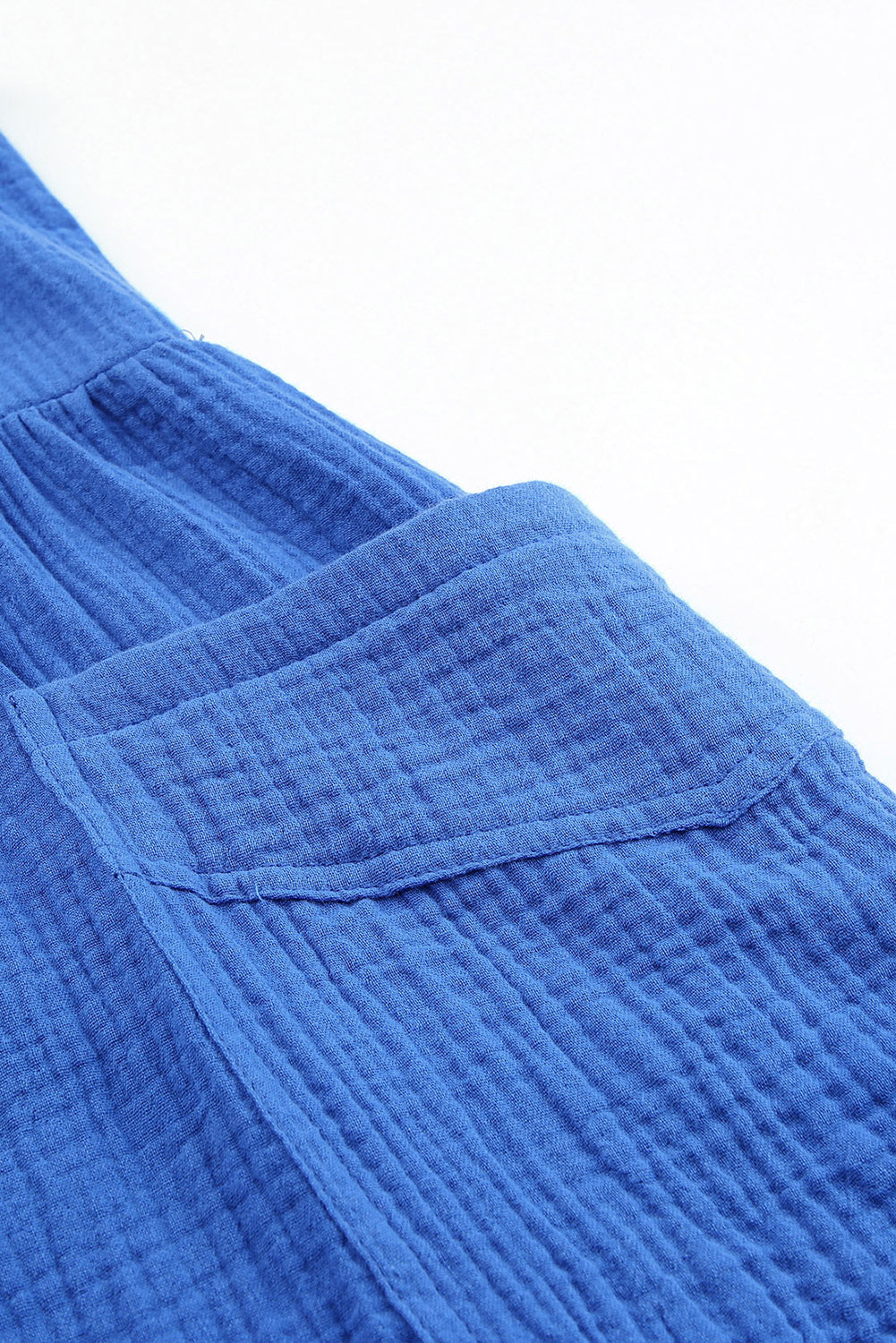 Barboteuse bleue texturée à bretelles nouées, taille haute, jambes larges