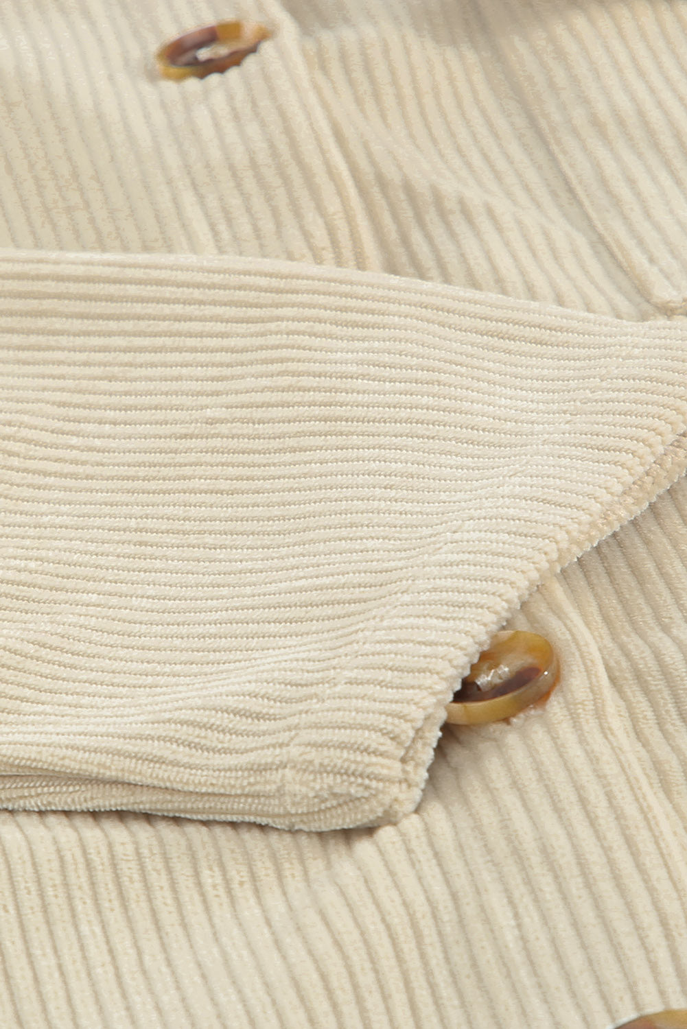 Veste beige texturée côtelée avec poches et boutons
