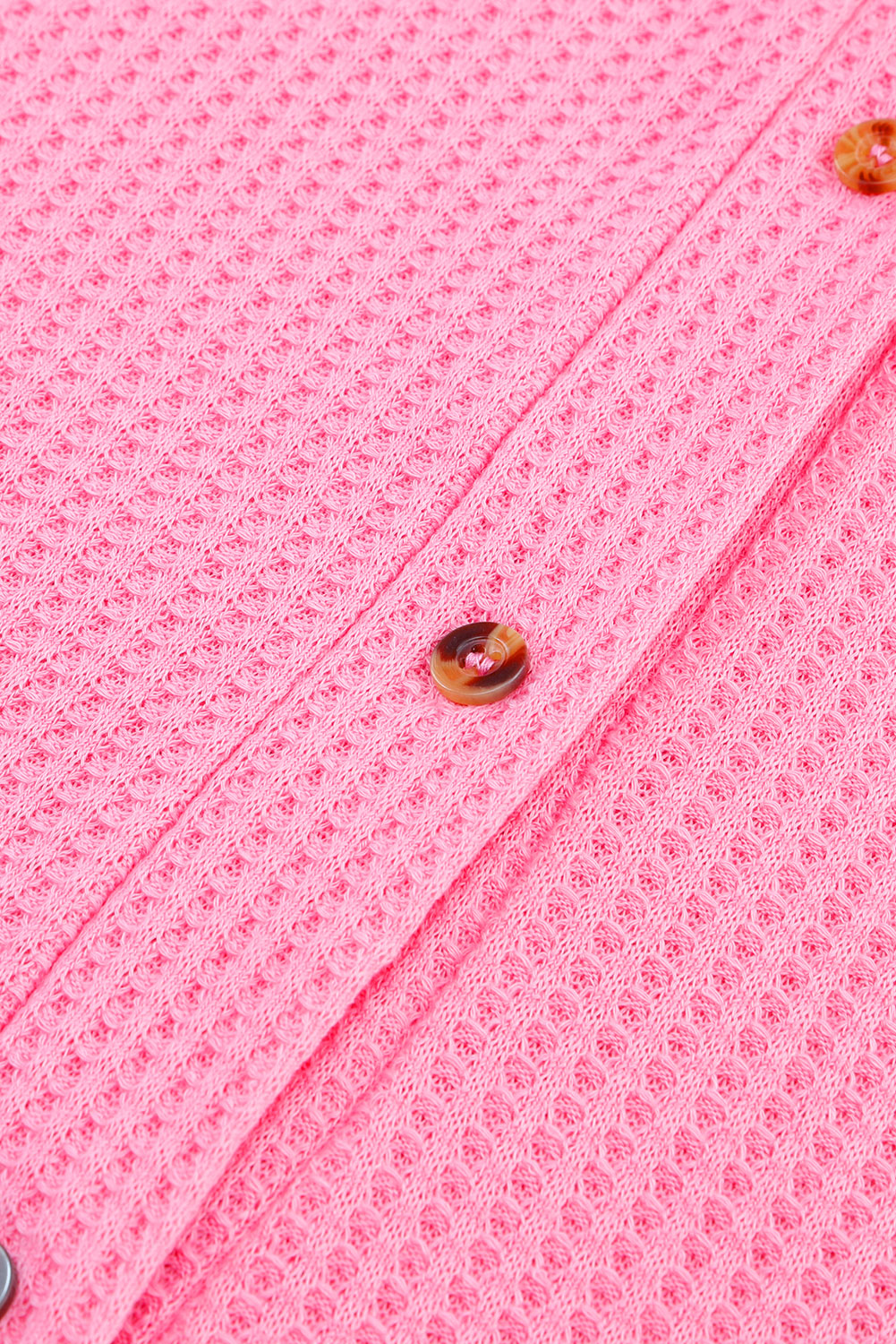 Rožnata vafelj pletena jopica s spuščenimi rameni