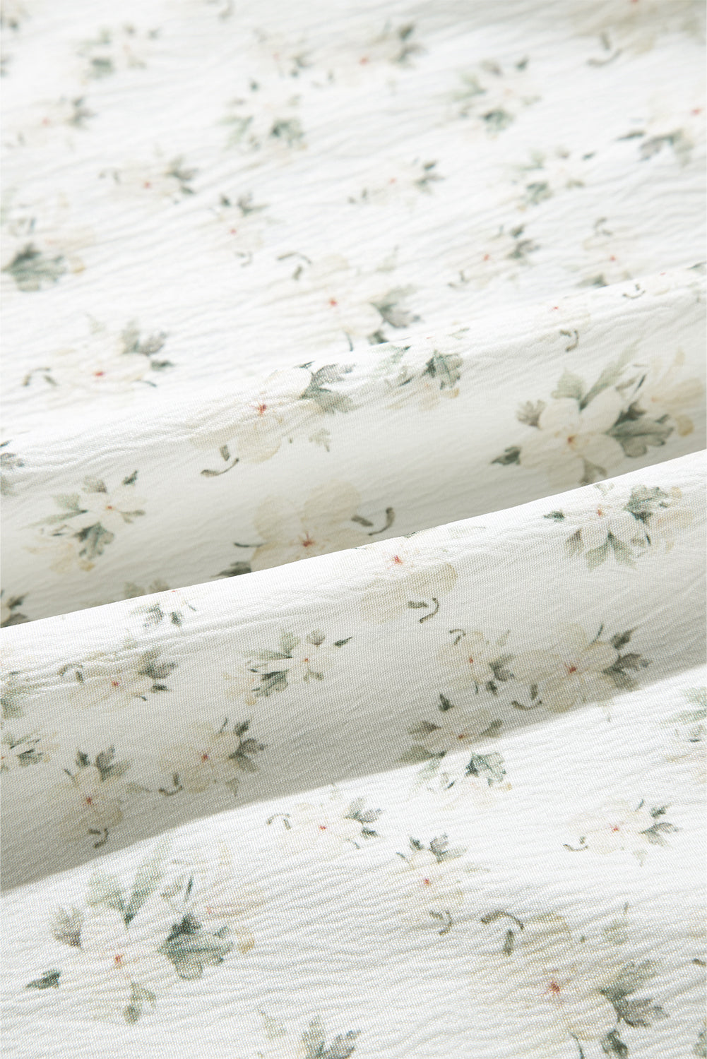 Bijeli boho cvjetni kombinezon širokih nogavica kratkih puf rukava