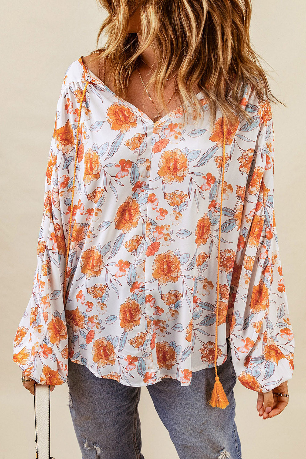 Orangefarbene Dolman-Bluse mit geteiltem V-Ausschnitt und Blumendruck