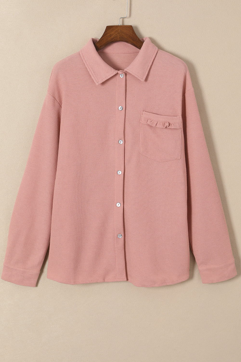 Veste en tricot gaufré rose à poche et volants