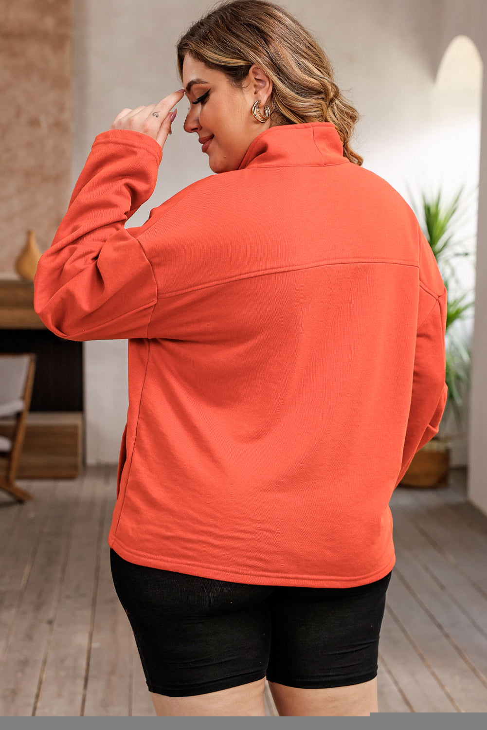 Orangefarbenes Sweatshirt mit O-Ring-Reißverschluss und Taschen in Übergröße