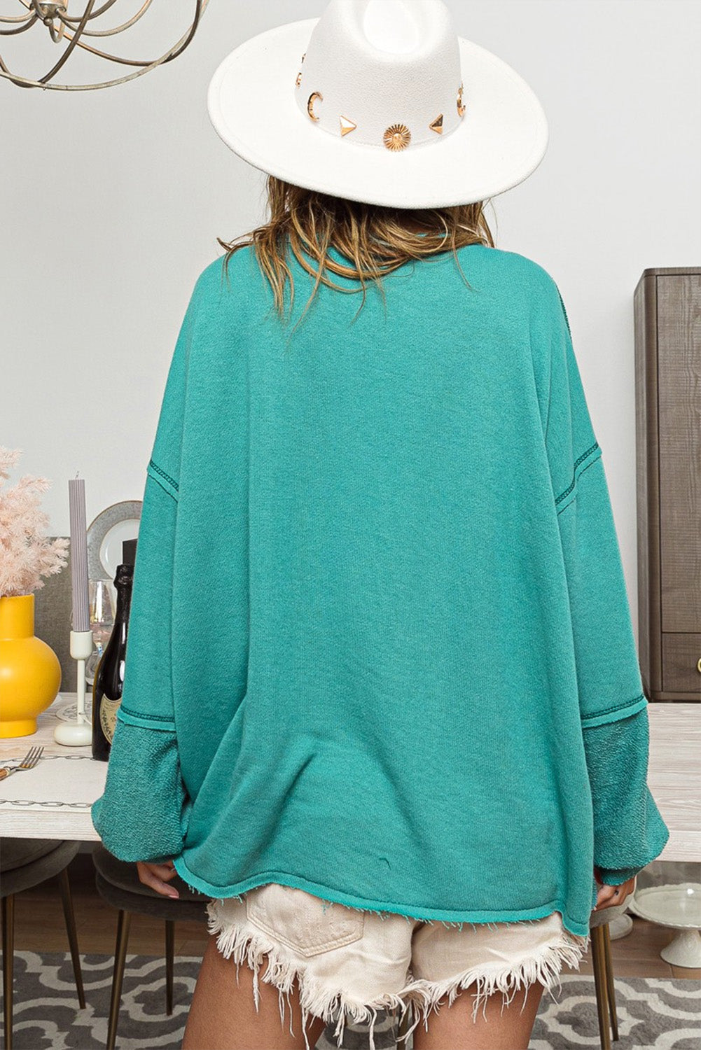 Seegrünes Baggy-Sweatshirt mit freiliegender Naht und hohem, niedrigem Saum