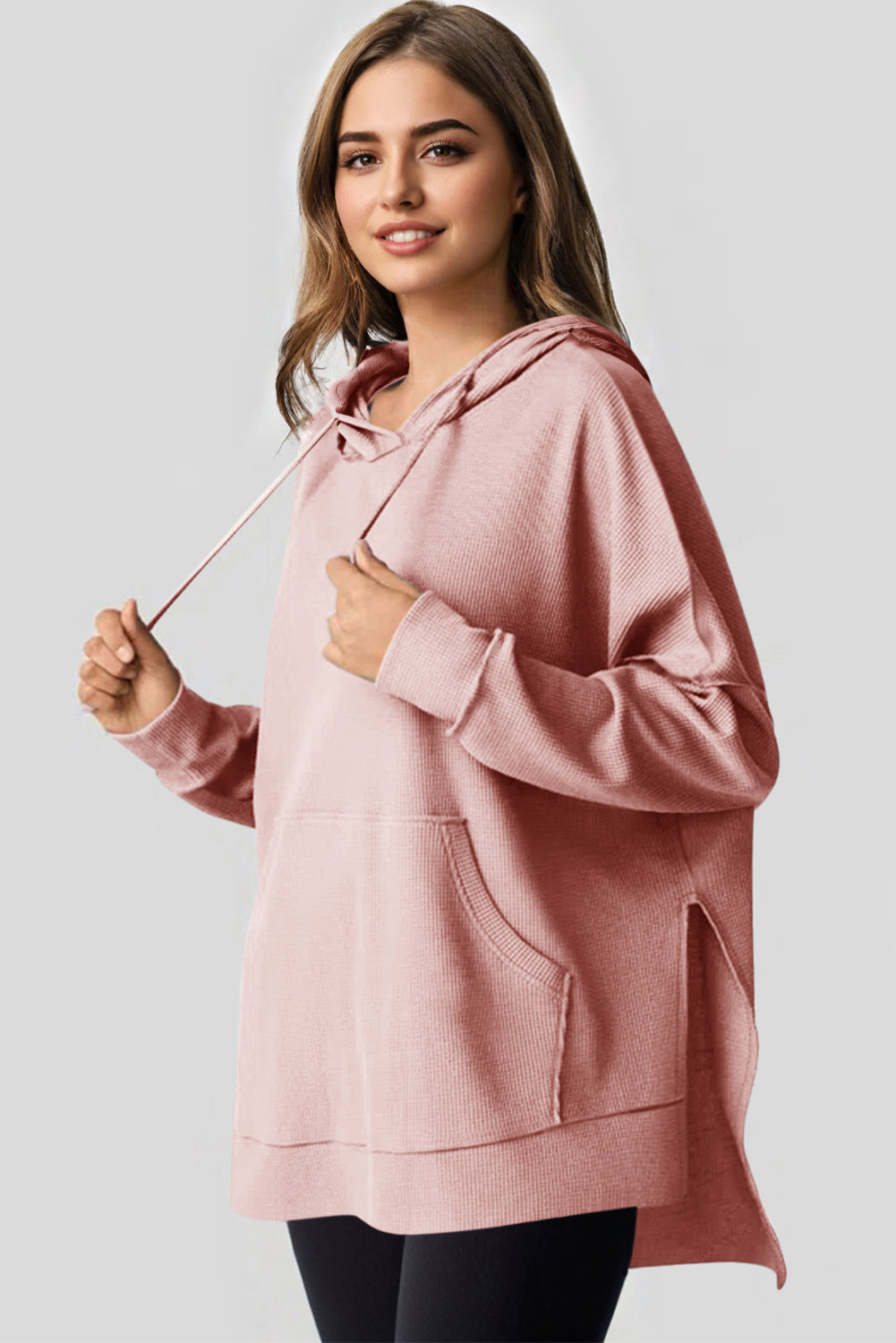 Sweat à capuche surdimensionné haut bas rose clair en tricot gaufré doublé de polaire