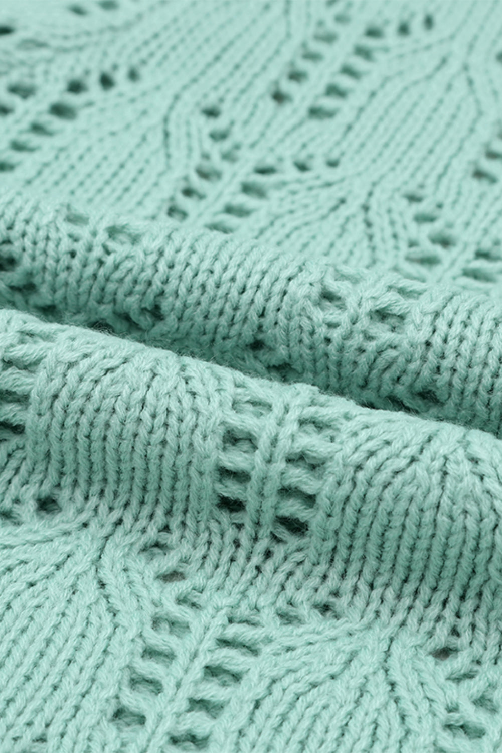 Zelen prosojen pleten pulover s konicami