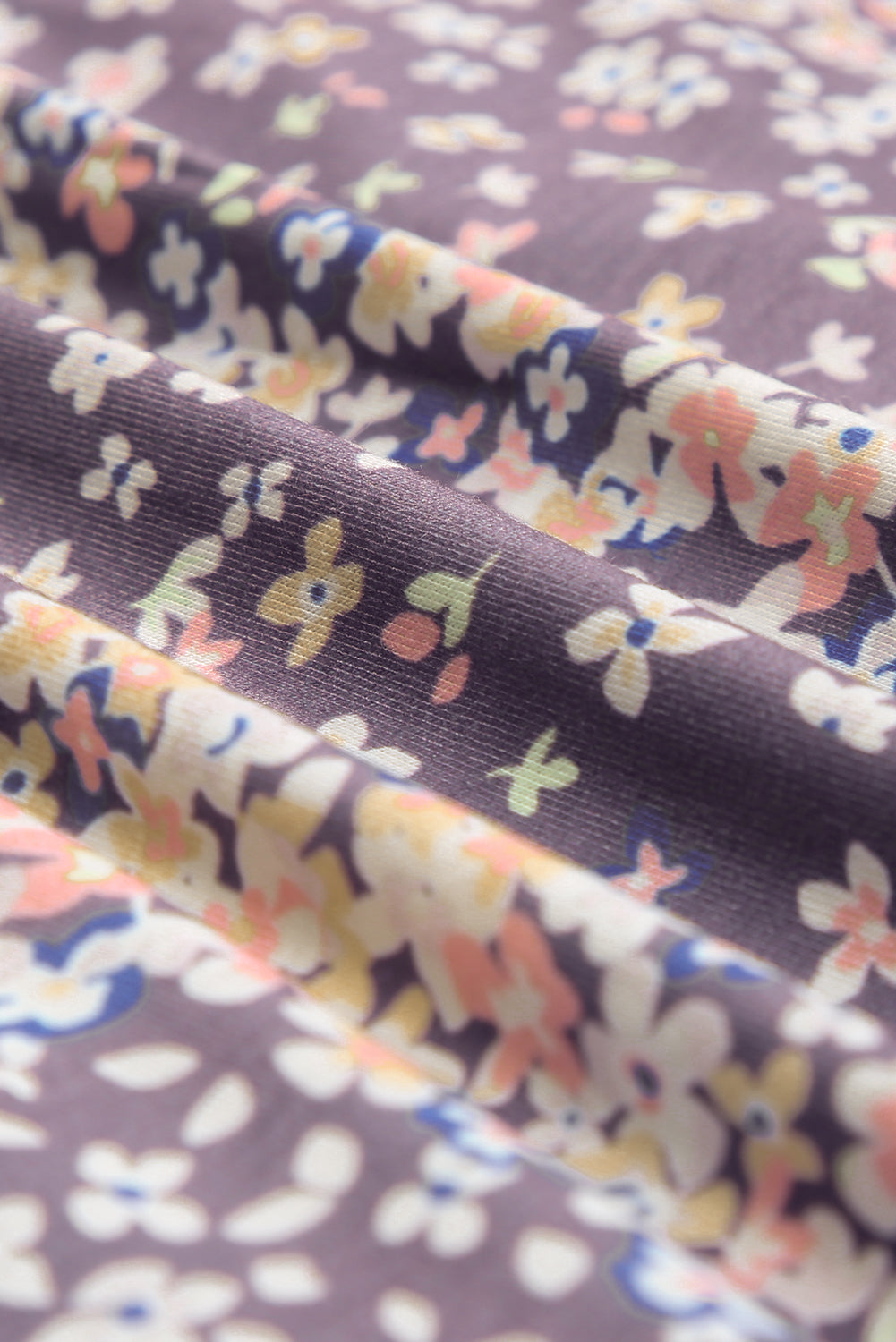 Lilafarbene Babydoll-Bluse mit Rundhalsausschnitt und Blumenmuster in Übergröße