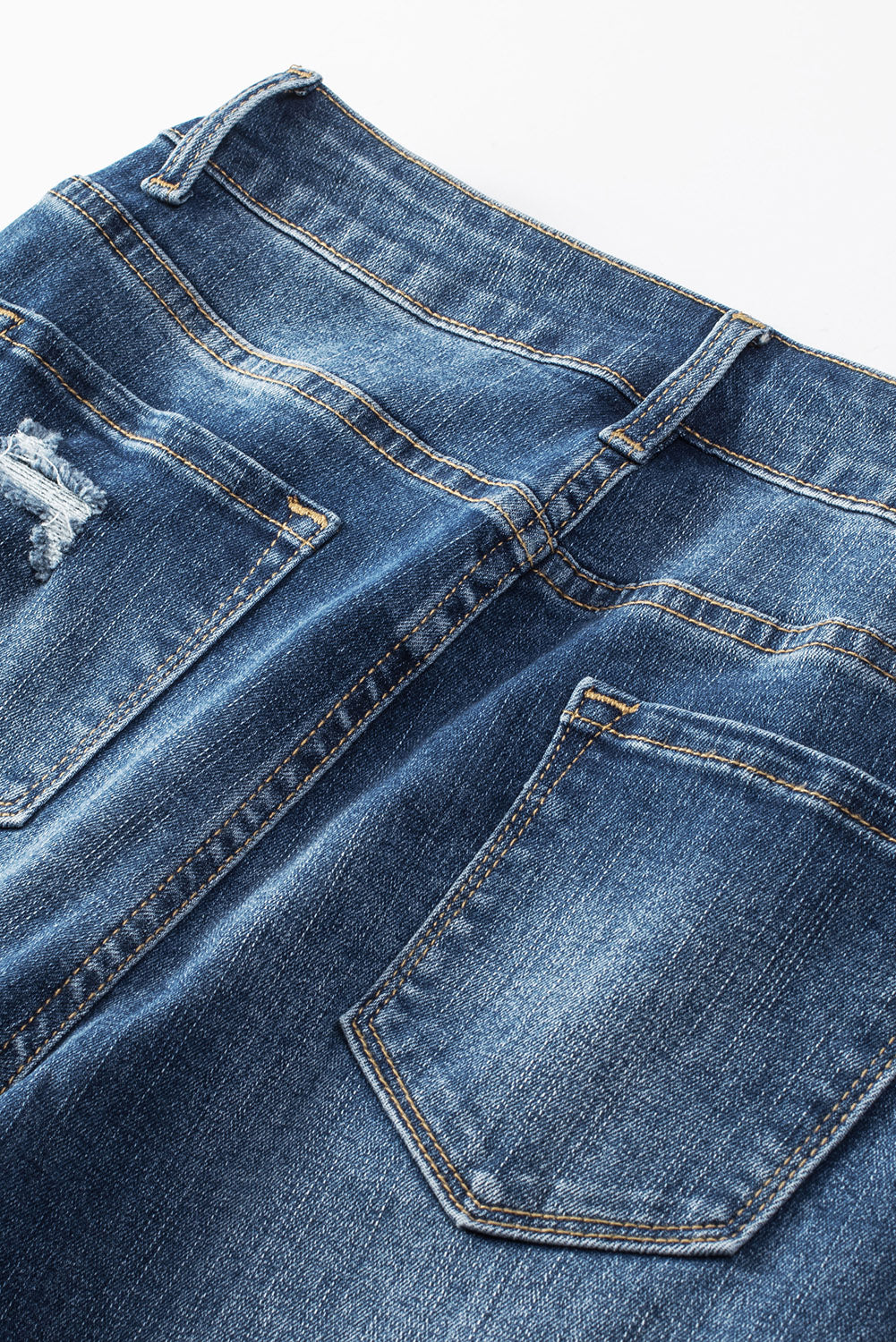 Jeans skinny a vita alta con bottoni blu invecchiati