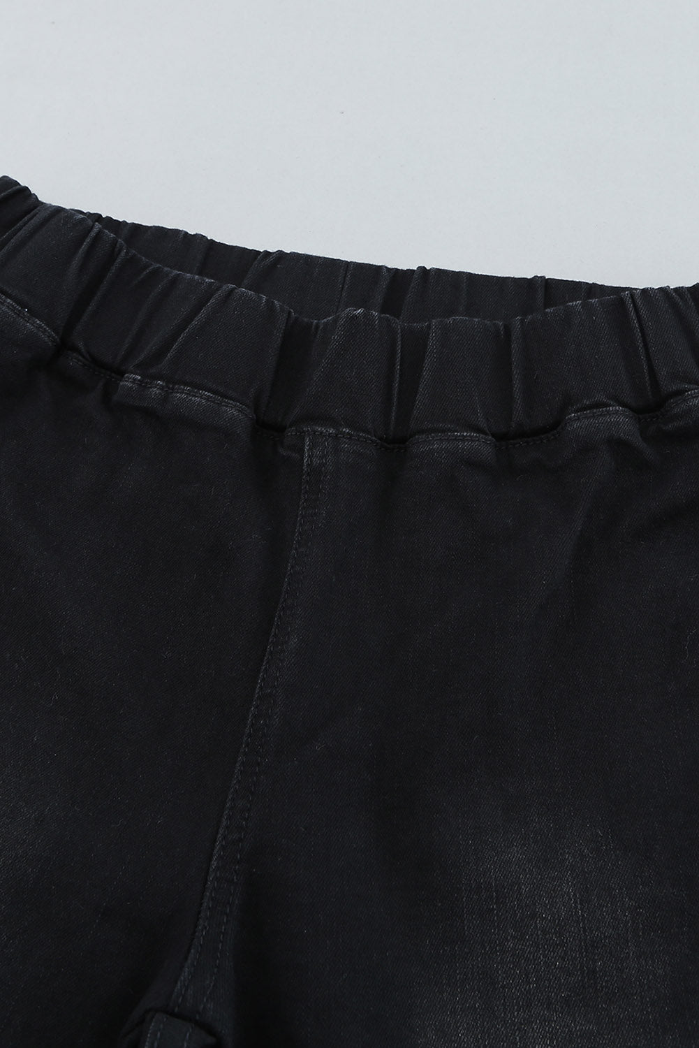 Pantalon en denim noir effet vieilli à cloche