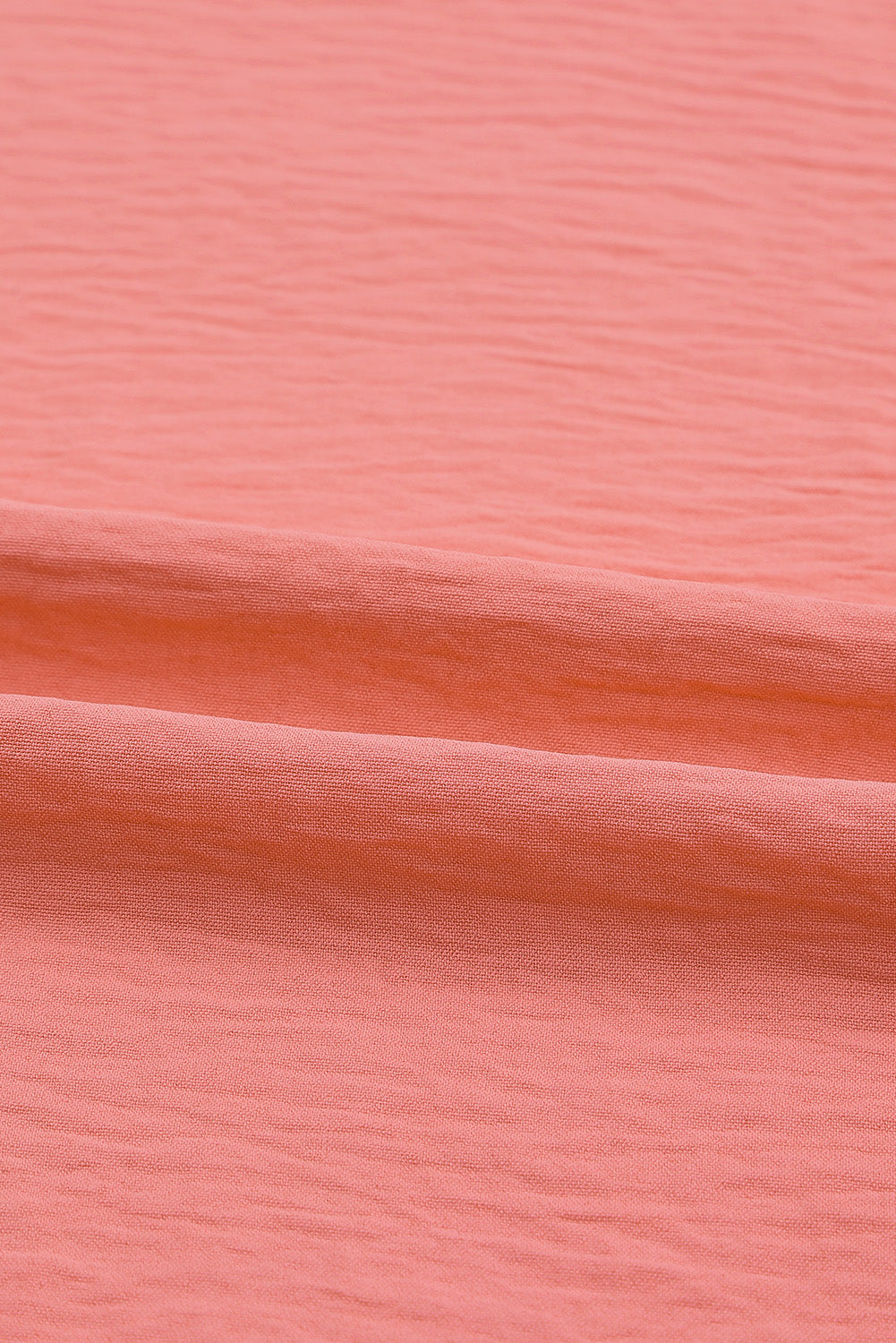 Top a trapezio con polsini in smock color albicocca
