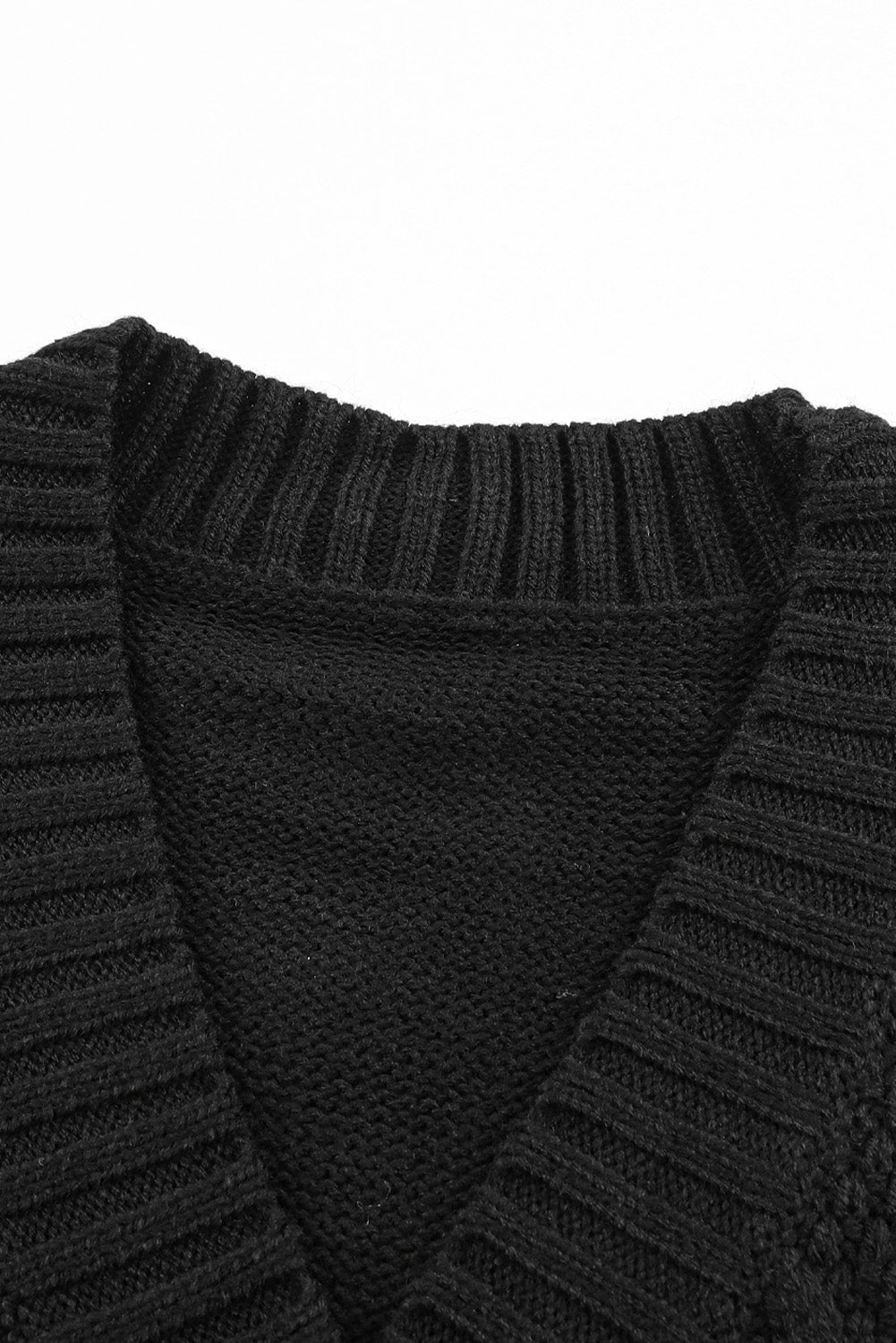 Črna teksturirana jopica s sprednjimi žepi in gumbi