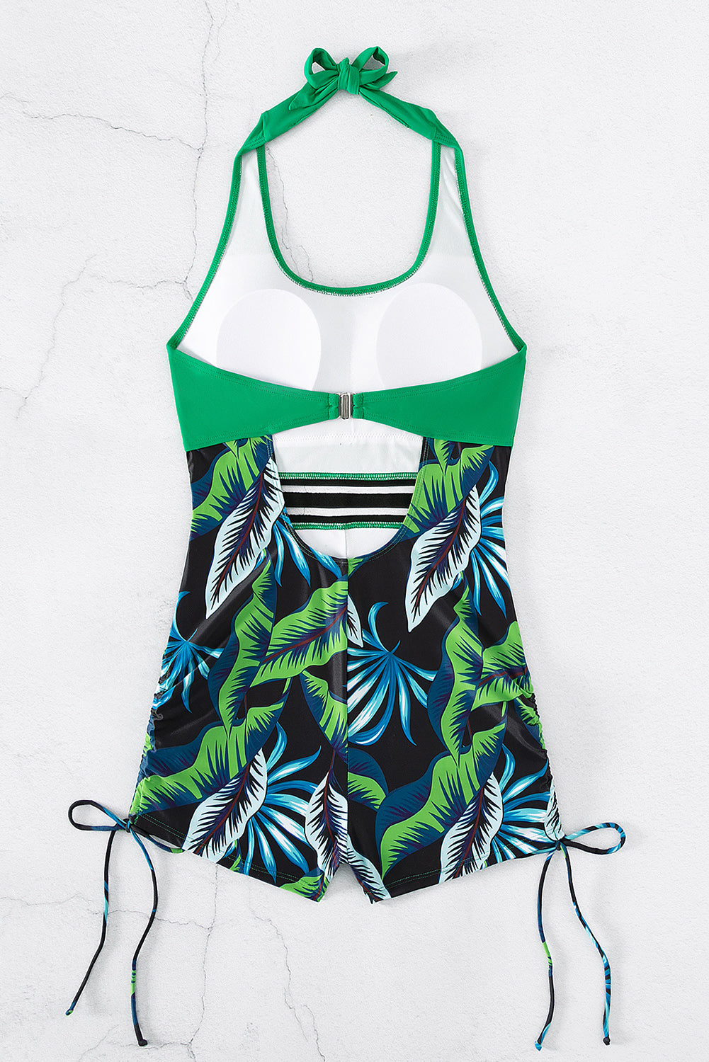 Monokini senza schienale laterale con stampa di foglie tropicali verde brillante