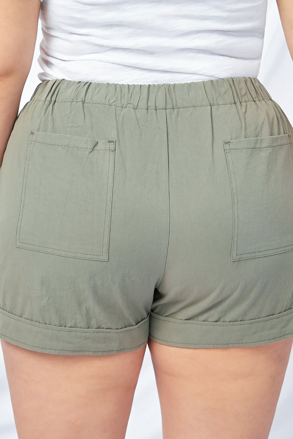 Grüne Shorts mit Kordelzug und Tasche und elastischem Bund