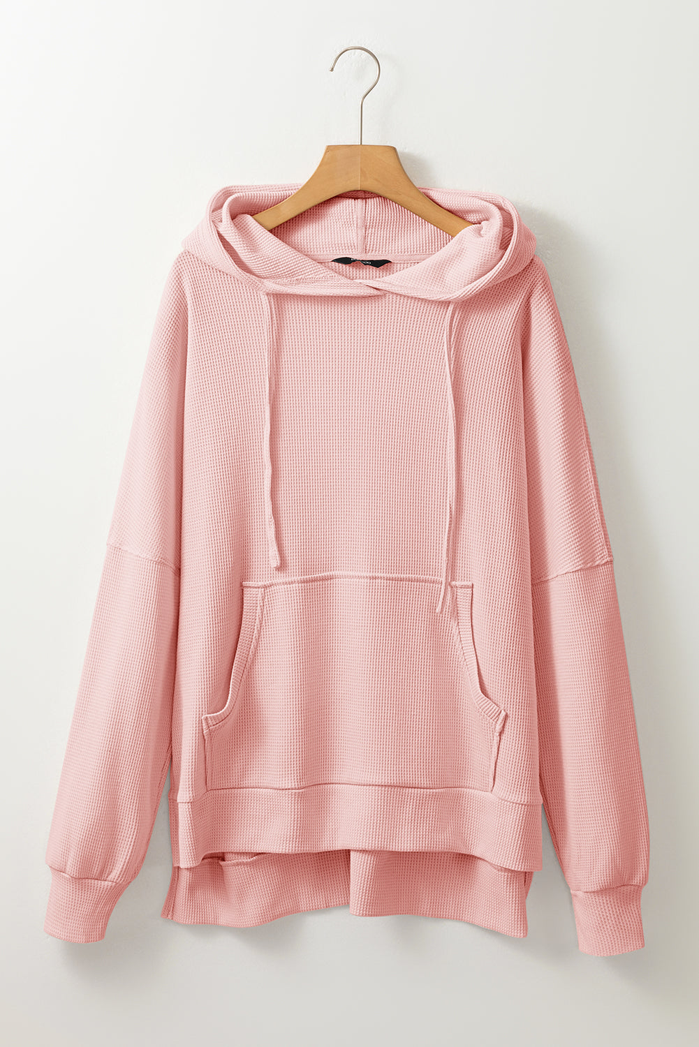 Sweat à capuche surdimensionné haut bas rose clair en tricot gaufré doublé de polaire