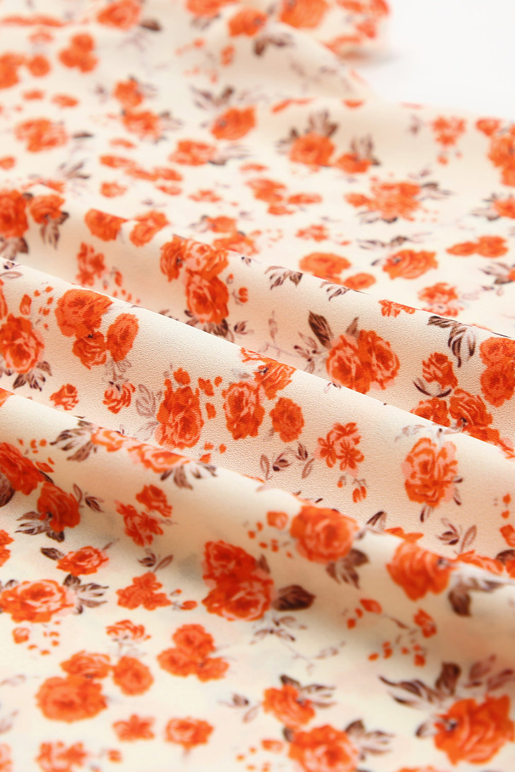Oranžna bluza s cvetličnimi rokavi v več stopnjah