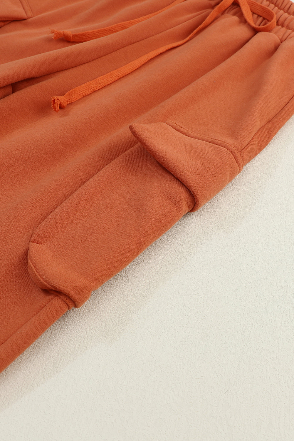 Oranžne jogger hlače z vrvico in kargo žepi