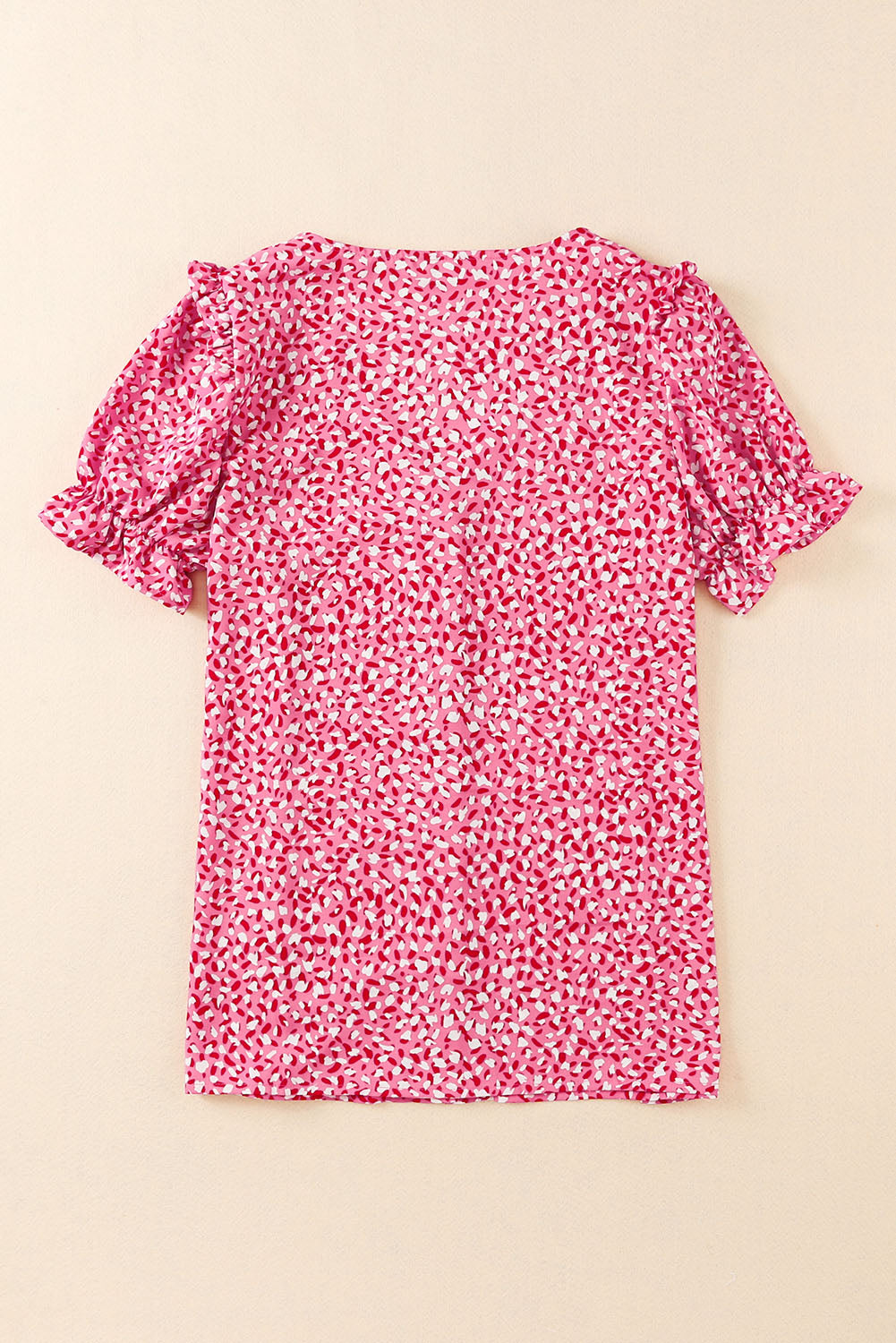 Roza srajca z abstraktnim potiskom in gumbi z naborki