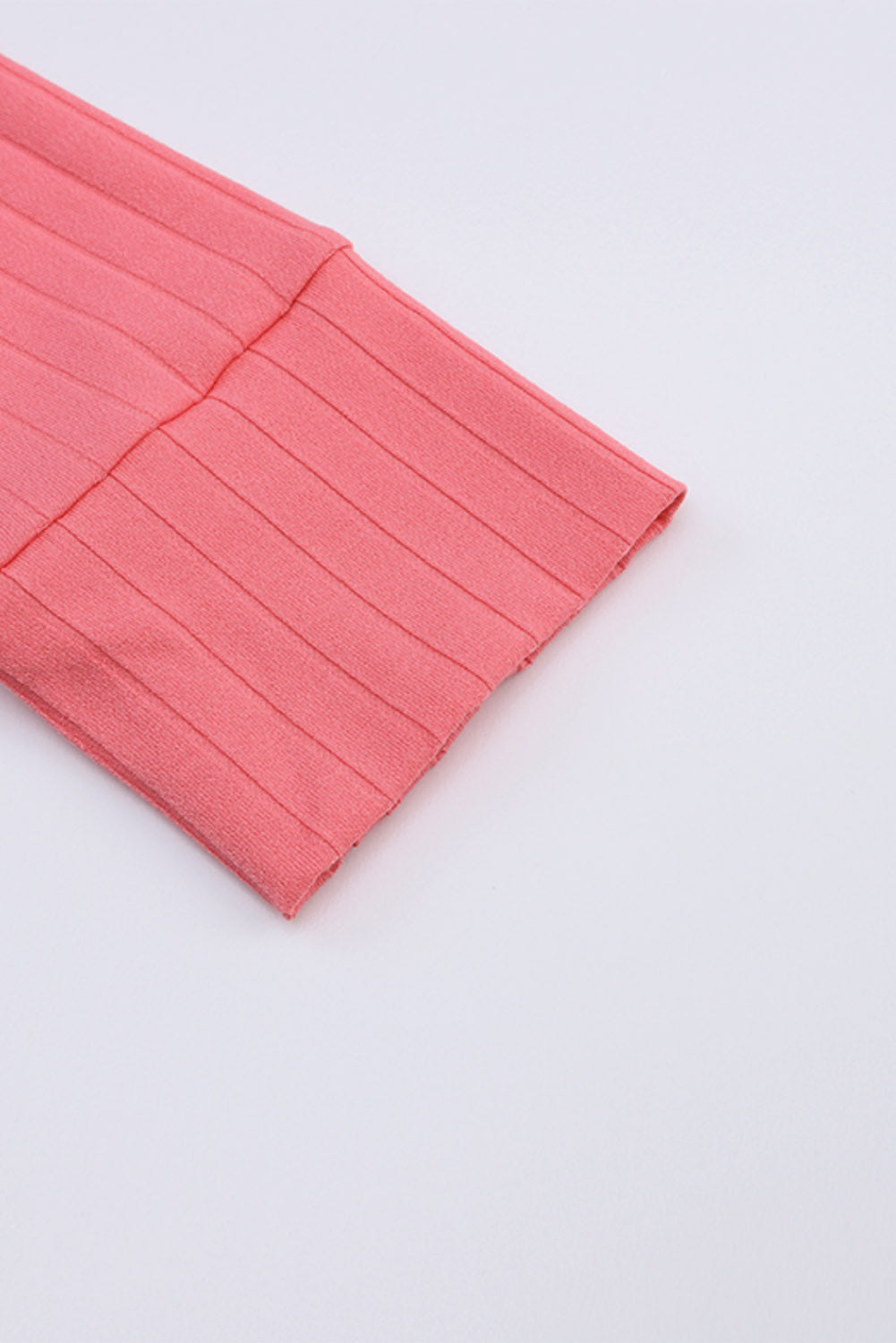 Rožnata odprta pletena jopica z žepi na sprednji strani