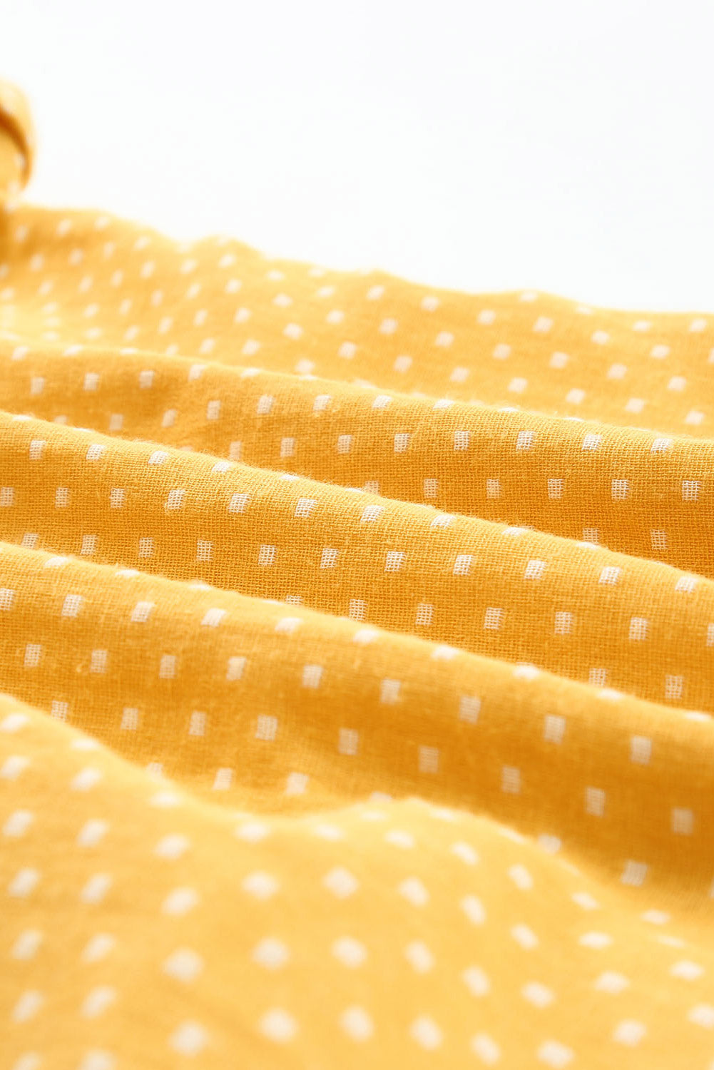 Chemise jaune roulée à manches courtes et imprimé à pois